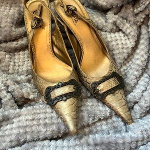 Gold sling back heels. Gently used, some signs of wear on the toe and heel.